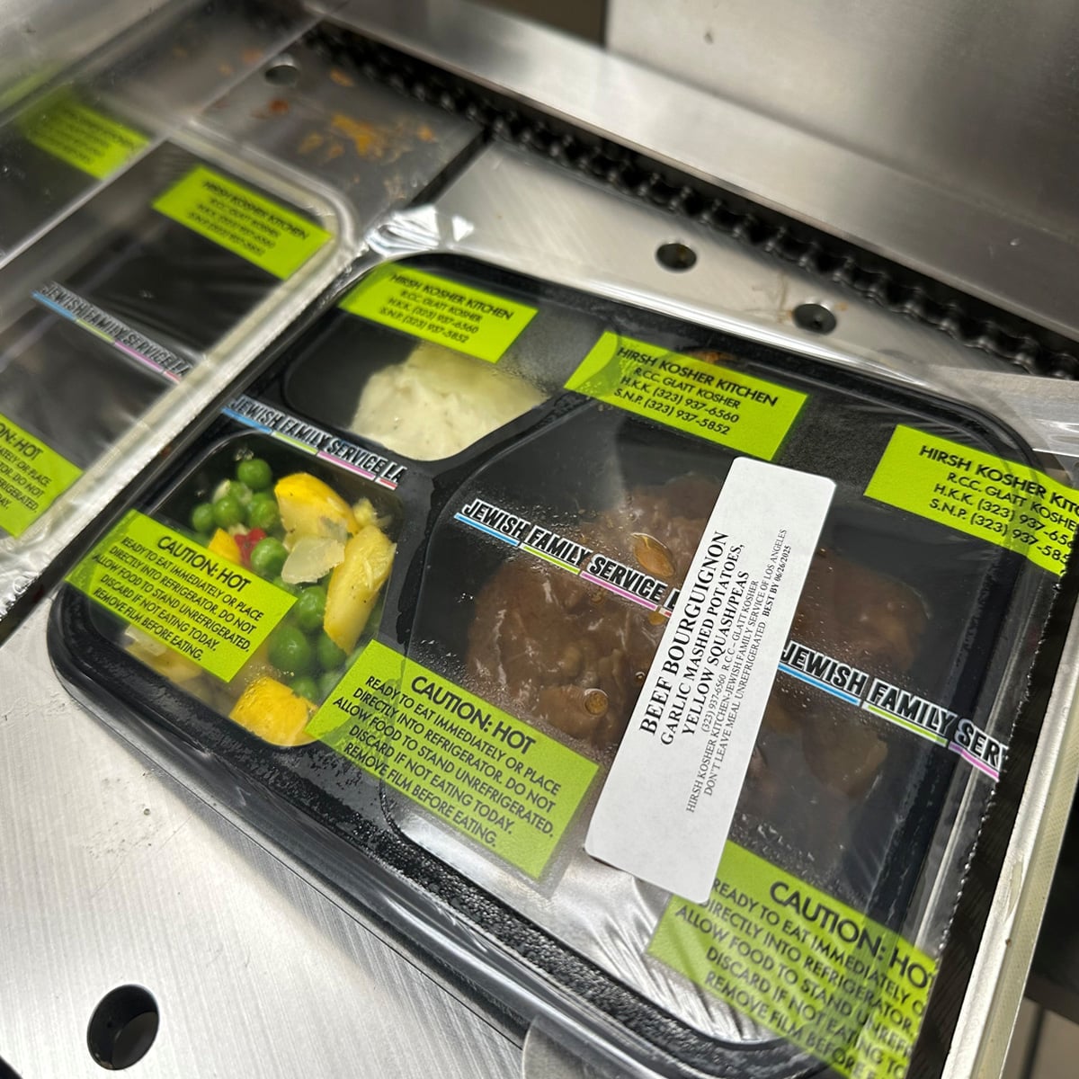 Platinum Packaging's Tray Sealer Machines sealing meal trays
